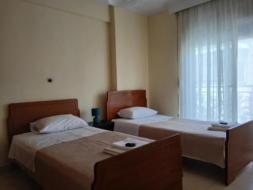 Postel nebo postele na pokoji v ubytování Ananias house
