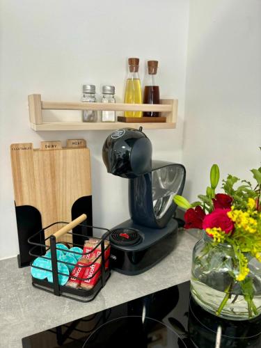 a coffee maker sitting on top of a counter at Stylish and Chic Seaside Apartment in Southend-on-Sea