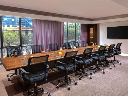 a large conference room with a long table and chairs at Pullman Nairobi Upper Hill in Nairobi
