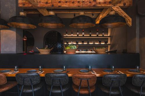 a dining room with a wooden table and chairs at Ona Lomas Village - La Manga Club in La Manga del Mar Menor