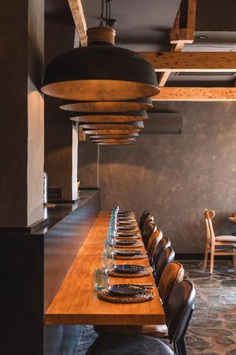 a long table with wine glasses on top of it at Ona Lomas Village - La Manga Club in La Manga del Mar Menor