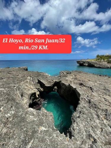 a hole in a rock in the ocean at Apto close to more than 19 tourist attractions in La Entrada