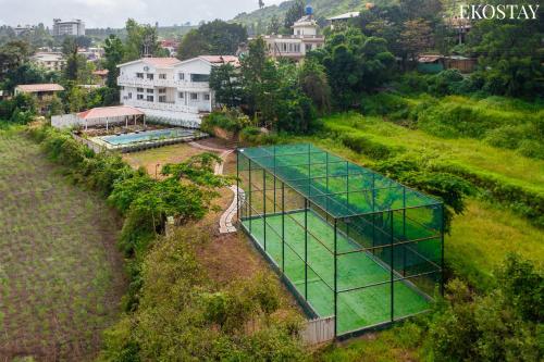 an overhead view of a greenhouse in a garden at EKOSTAY Gold - White Swan Villa 6BHK in Panchgani