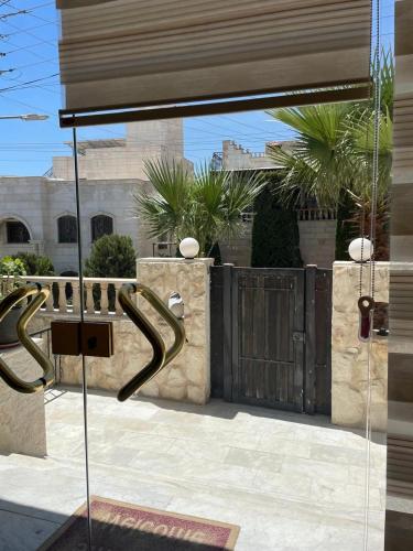 a front door of a house with a gate at Shafa Badran Villa in Amman