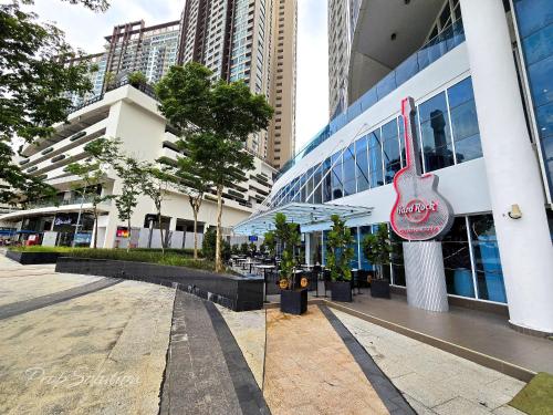 a building with a guitar sign on the side of it at Loft Suite Johor Bahru Legoland 6Pax in Iskandar Puteri