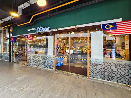 a store front with glass doors on a street at Loft Suite Johor Bahru Legoland 6Pax in Iskandar Puteri