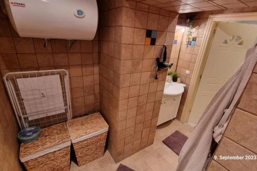 a bathroom with a shower with a toilet and a sink at Poseidons Retreat optional el car and airporttrans in Sounio