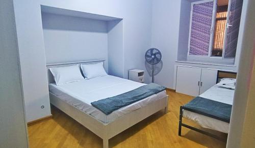 Postel nebo postele na pokoji v ubytování Olympic Hostel