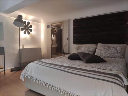 A bed or beds in a room at Palazzo Mandurino luxury relais