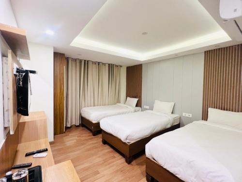 Cama o camas de una habitación en Hotel Nirakar