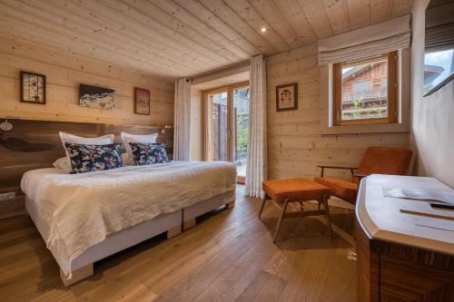 Postel nebo postele na pokoji v ubytování Flocons de Sel - Relais & Chateaux