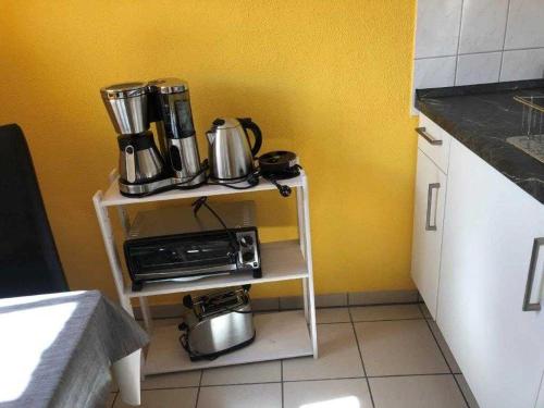 a table with pots and pans on it in a kitchen at Ferienwohnung Maltzahn & Beese in Jabel