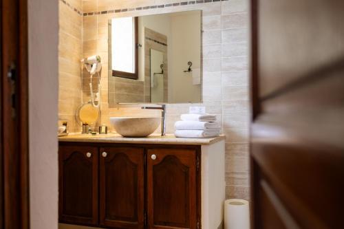 a bathroom with a sink and a mirror at Château de Trigance in Trigance