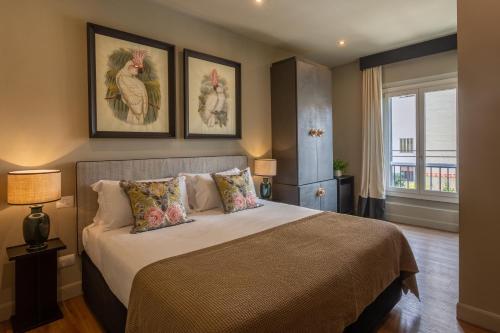 Postel nebo postele na pokoji v ubytování Boutique Hotel Hugo