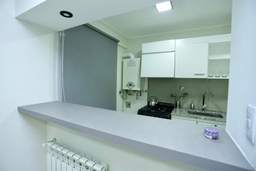 Dapur atau dapur kecil di Departamento en Trelew - céntrico y moderno