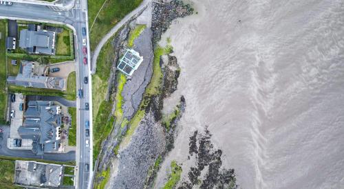 an aerial view of a beach and the ocean at Waterfront House & Restaurant in Enniscrone
