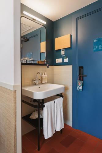 a bathroom with a sink and a mirror at Hotel Casa Bonay & Spa in Barcelona