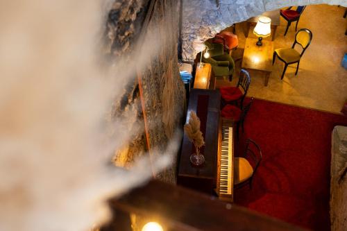 an overhead view of a living room with a fireplace at Château de Trigance in Trigance