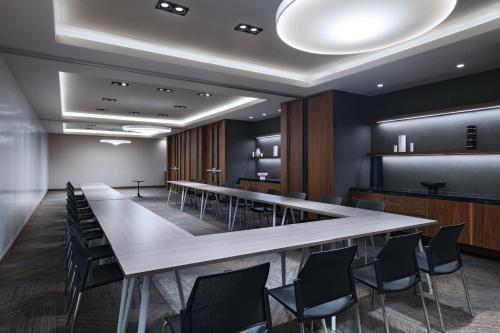 a conference room with a long table and chairs at AC Hotel by Marriott Monterrey Valle in Monterrey