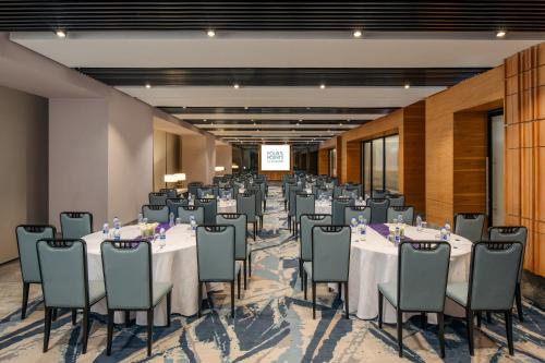a banquet hall with tables and chairs in a room at Four Points by Sheraton Kampala in Kampala
