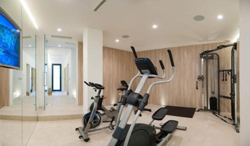 a gym with two exercise bikes in a room at Luxury Seafront Villa Prestige Brac with private pool, sauna and gym and private sea deck at the beach on Brac island in Selca