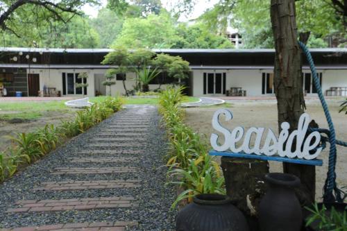 a sign that reads scalledolithic sits in front of a building at Samba Bluewater Resort in Olongapo