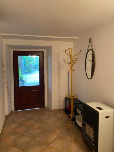 a living room with a door and a television at Apartment Rustic Jolly in Premantura