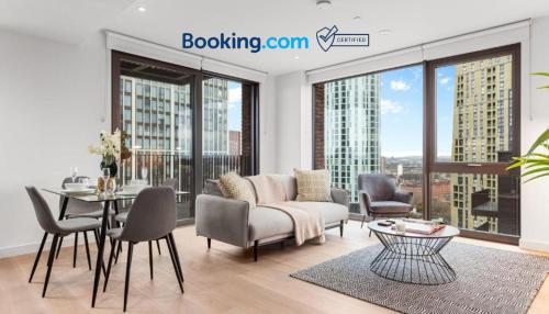 a living room with a couch and chairs and a table at Central London New 2 bedroom flat Riverview Balcony in London