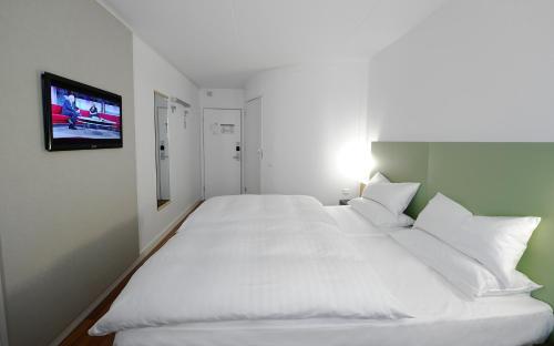 Letto o letti in una camera di Good Morning Kista