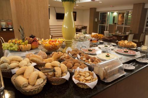 a table with many different types of food on it at Bristol Jangada Fortaleza Meirelles in Fortaleza