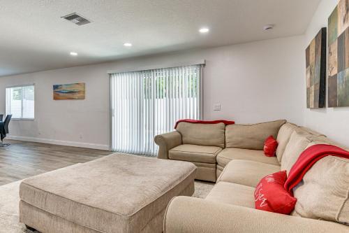 a living room with a couch and a table at Cocoa Beach Home with Private Pool about half Mi to Beach in Cocoa Beach