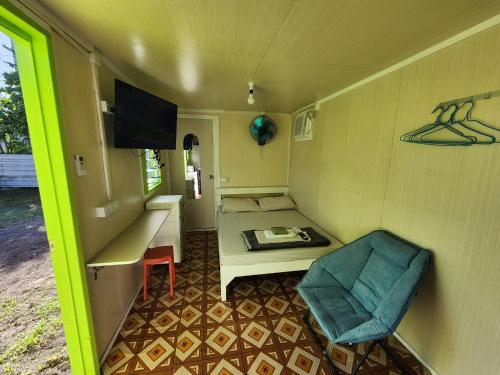 a room with a bed and a table and a chair at GoodWorks Accommodation in Yangor