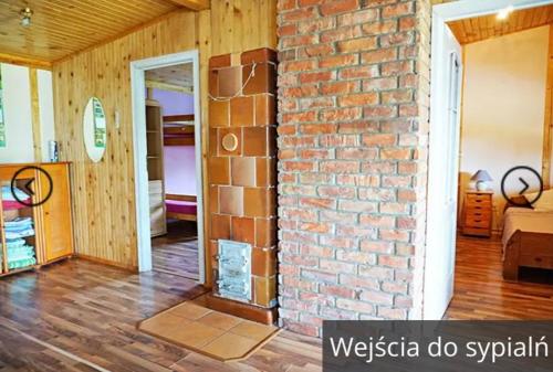 Postel nebo postele na pokoji v ubytování Domek na Kaszubach