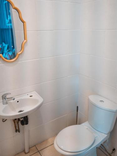 a bathroom with a toilet and a sink at Plein On Suid Guesthouse in Polokwane