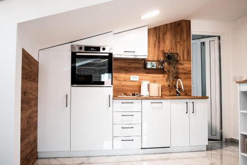 Kuchyň nebo kuchyňský kout v ubytování Apartman Sofija Kotor-Ljesevici