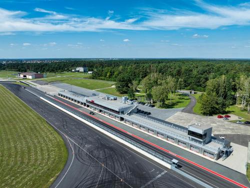 an overhead view of a train station next to a highway at Hotel Aviator in Kamień Śląski
