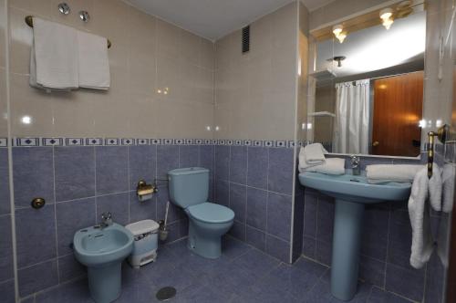 Ένα μπάνιο στο Apartamentos Tao