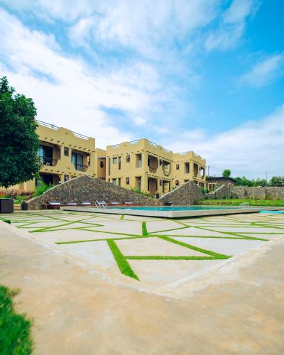 a tennis court in front of a building at The Maridadi Hotel in Moshi