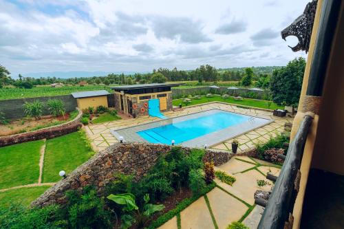 an aerial view of a swimming pool in a yard at The Maridadi Hotel in Moshi