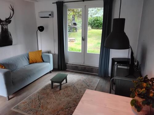 a living room with a couch and a table at Hochwald chalet in Bad Sachsa