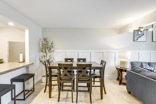 a dining room with a table and chairs and a couch at Ellicottville Townhome Near Holiday Valley Resort! in Ellicottville