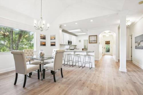 a dining room and kitchen with a table and chairs at Biloxi Waterfront House View of Bayou with fishing in Biloxi