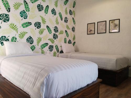 Cama o camas de una habitación en InN House Homestay