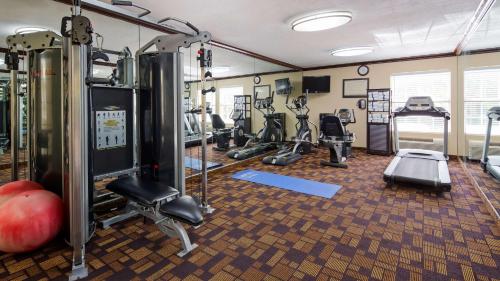 a fitness room with treadmills and exercise machines at Best Western Plus Addison/Dallas Hotel in Addison