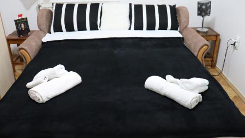 Una cama o camas en una habitación de Spasojević Apartman
