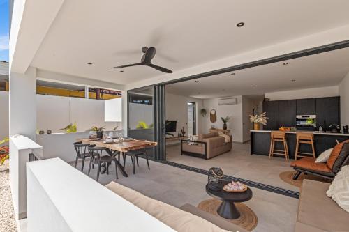 an open living room with a couch and a table at Zon&zo Luxurious Apartment in Jan Thiel in Jan Thiel