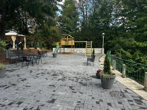a park with a playground and a play structure at Parkhotel Waldschlösschen in Annaberg-Buchholz