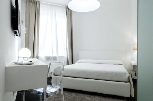 Postel nebo postele na pokoji v ubytování Vittoria Design Hotel di Luce Hotels