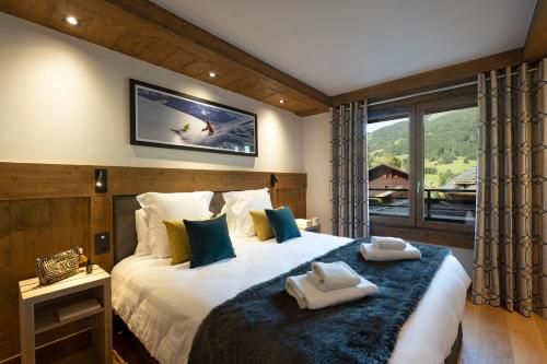 Postel nebo postele na pokoji v ubytování MGM Hôtels & Résidences - Hôtel Laska