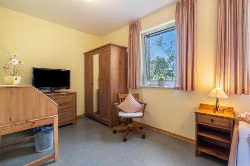 Televisyen dan/atau pusat hiburan di Gästezimmer - Meißen
